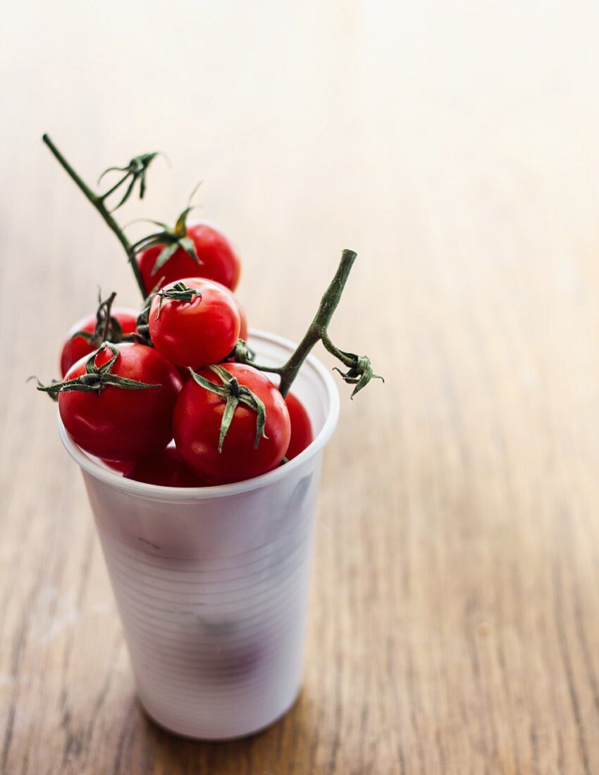 Cherry tomatoes in a plastic glass