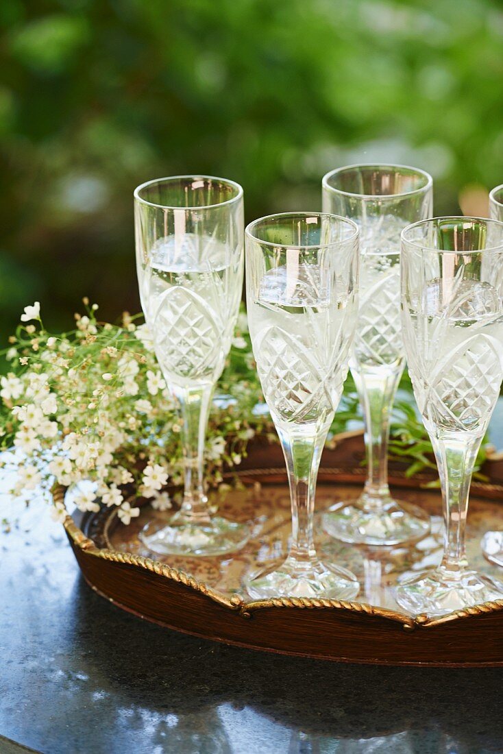 Crystal Champagne Glasses on a Tray; Filled with Prosecco