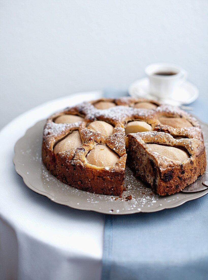 Pear and walnut cake, one slice removed