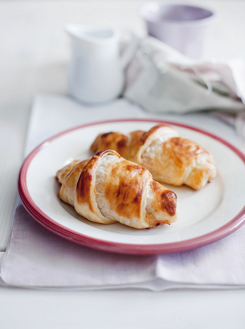 Two croissants on a plate