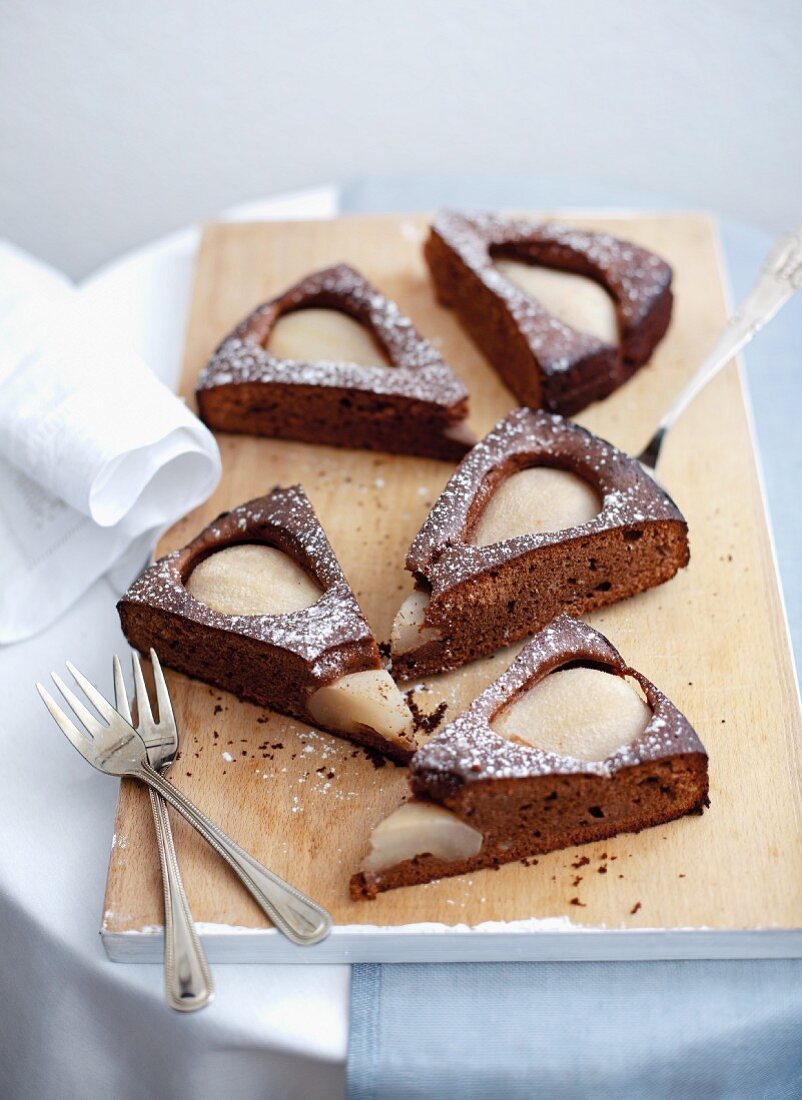 A few slices of chocolate cake with poached pears