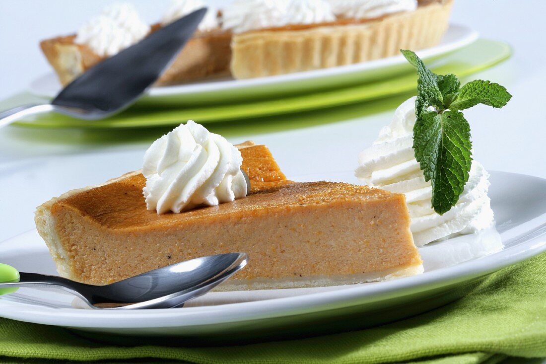 Pumpkin pie portion with whipped cream
