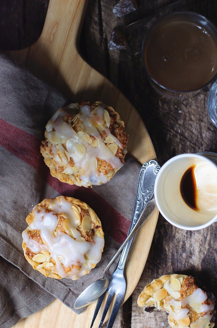 Puff pastry pies with sour cherry jam and flaked almonds