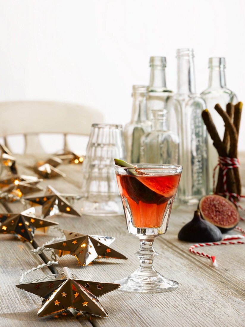 Fig Cocktail with Christmas Decorations & empty bottles