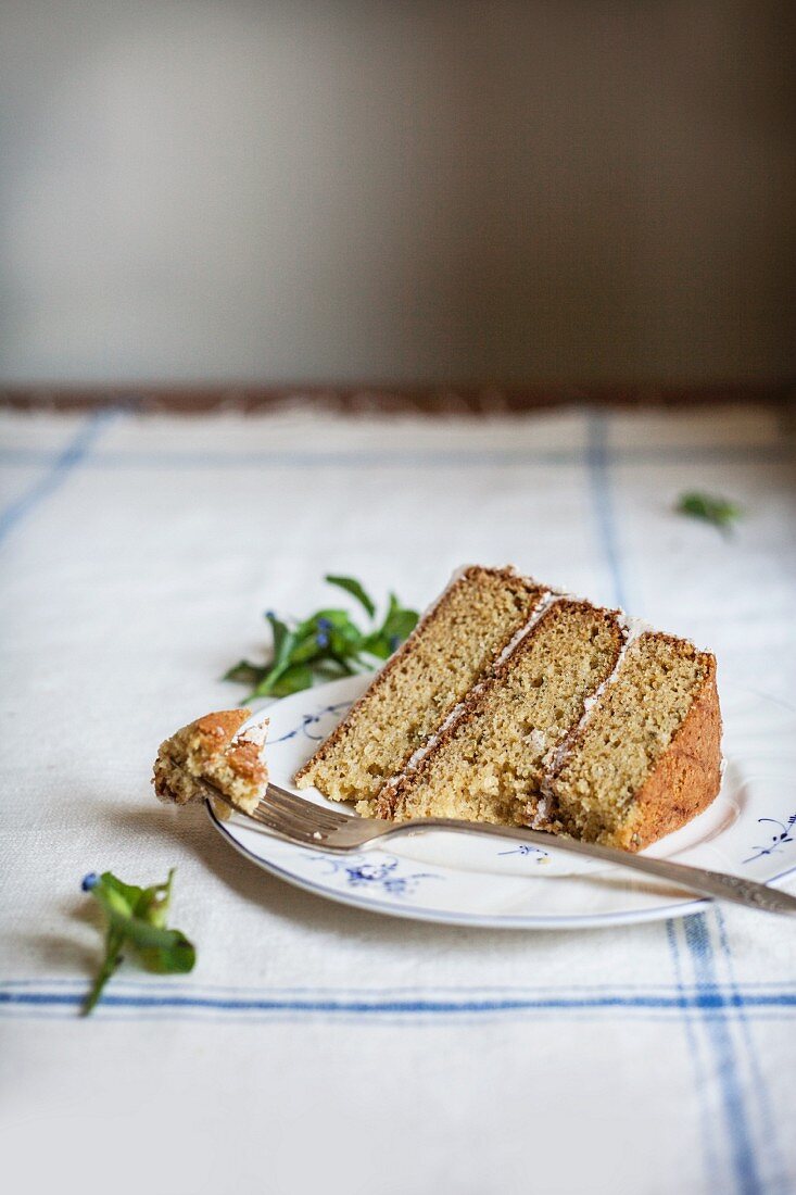 A Slice of Rosemary Corn Cake with Brown Butter and Honey Buttercream Frosting