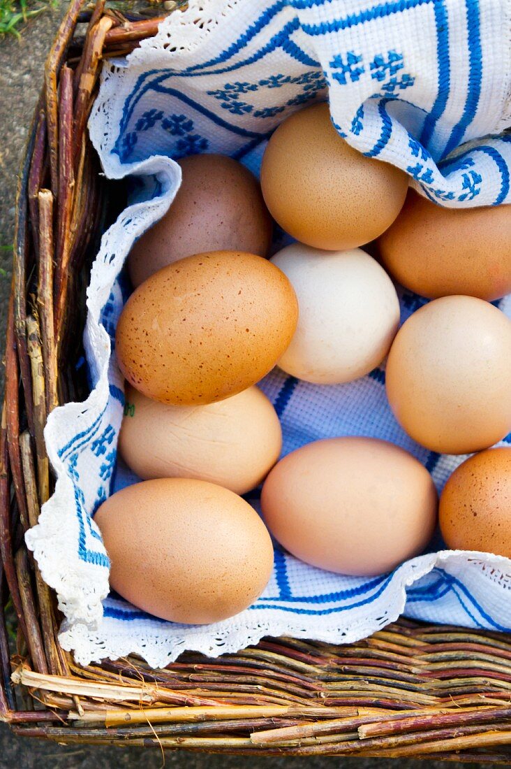 Brown hen's eggs in a basket (view from above)