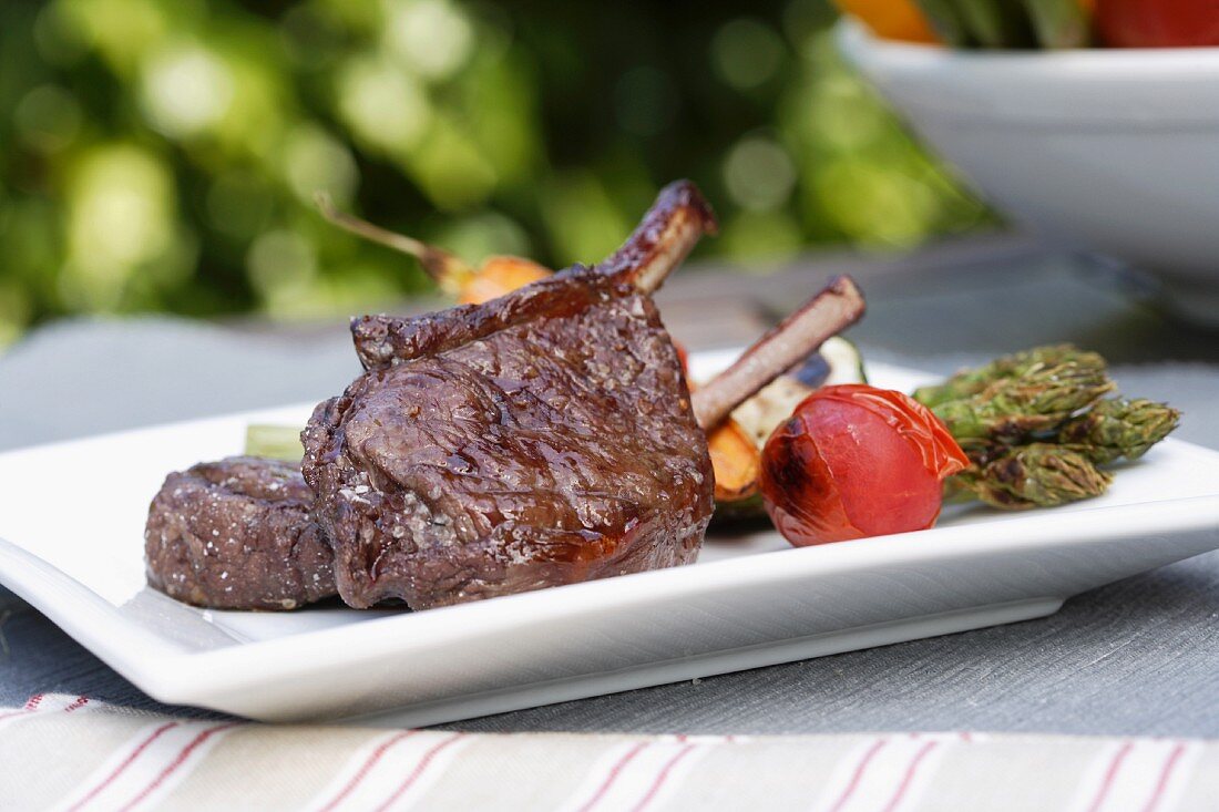 Venison chops with grilled vegetables on the barbeque