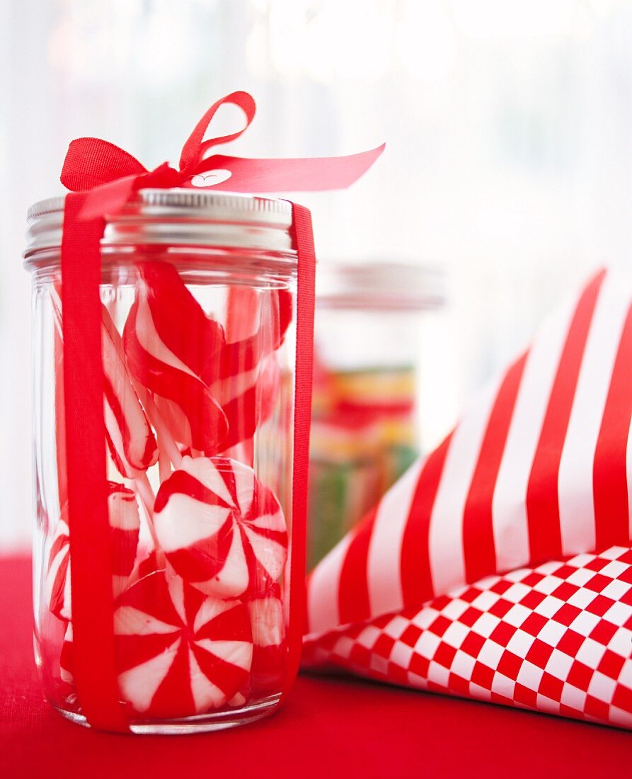 Red and white sweets in a jar