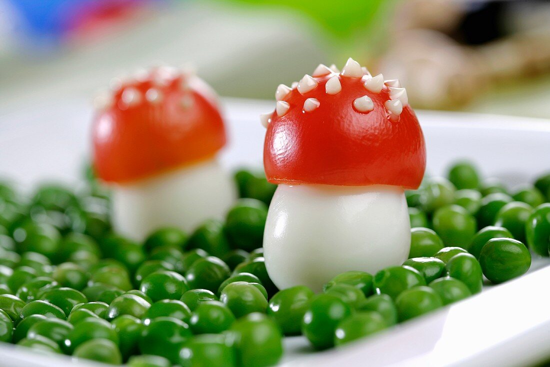 Fly agaric mushrooms made of egg and tomato, with peas