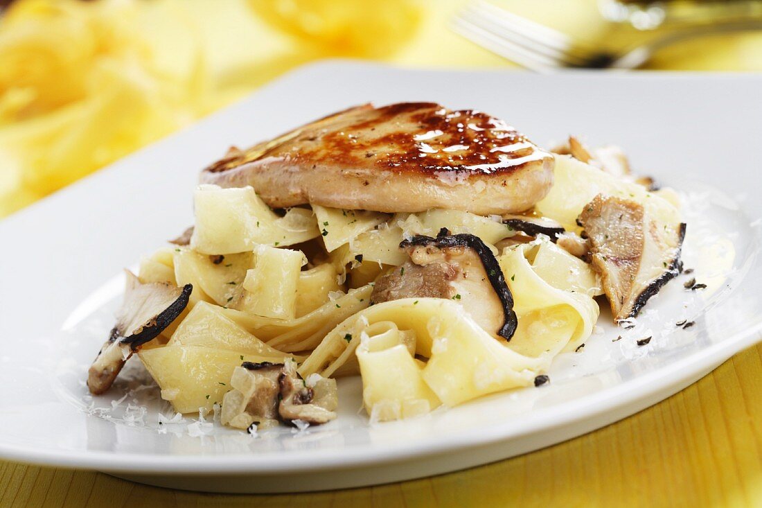 Ribbon pasta with mushrooms and goose liver