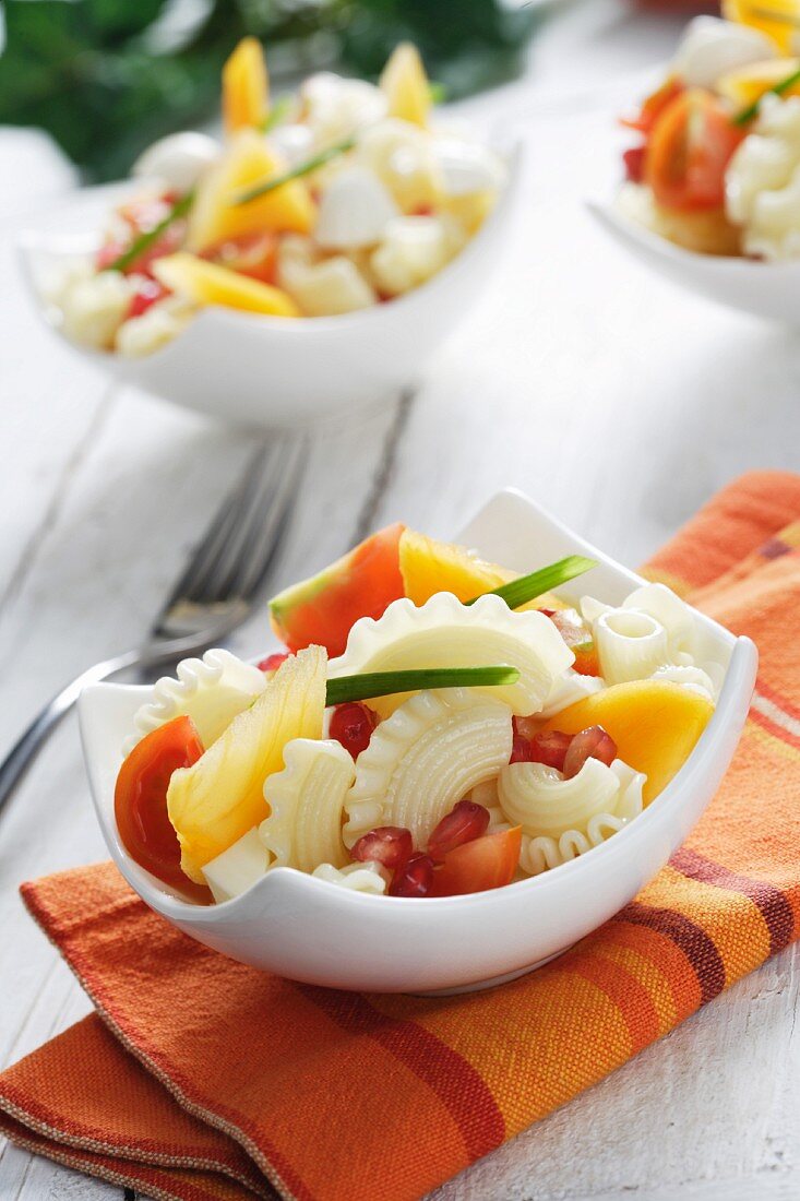 Pasta salad with Japanese persimmon and goat's cheese