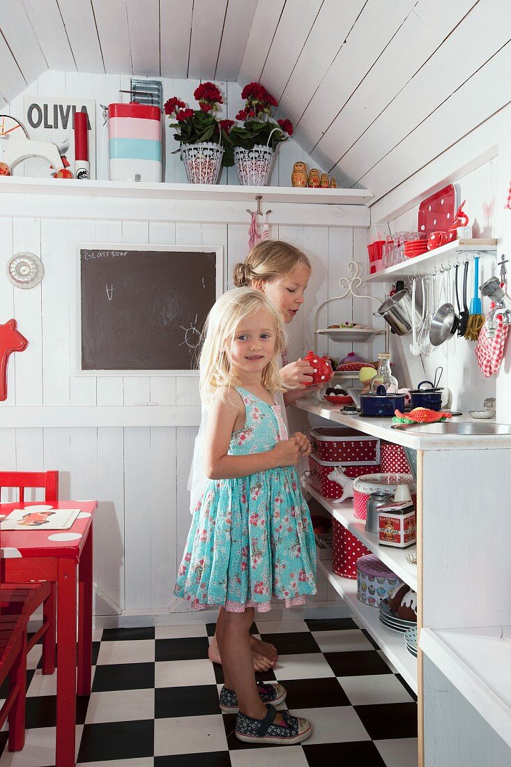 Girls playing in playhouse