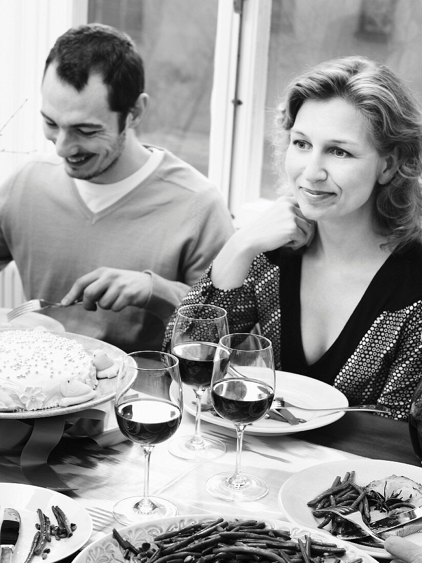 Couple eating at dining room table