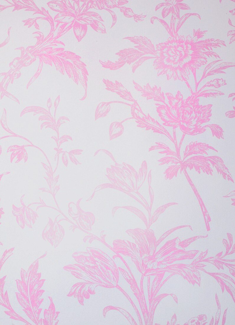 A background with a pale pink floral pattern