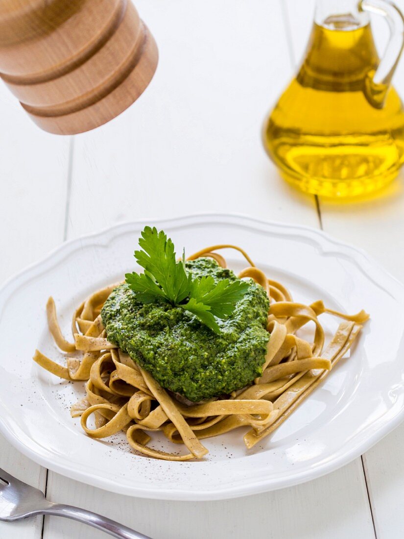 Green pesto served with homemade rye pasta.