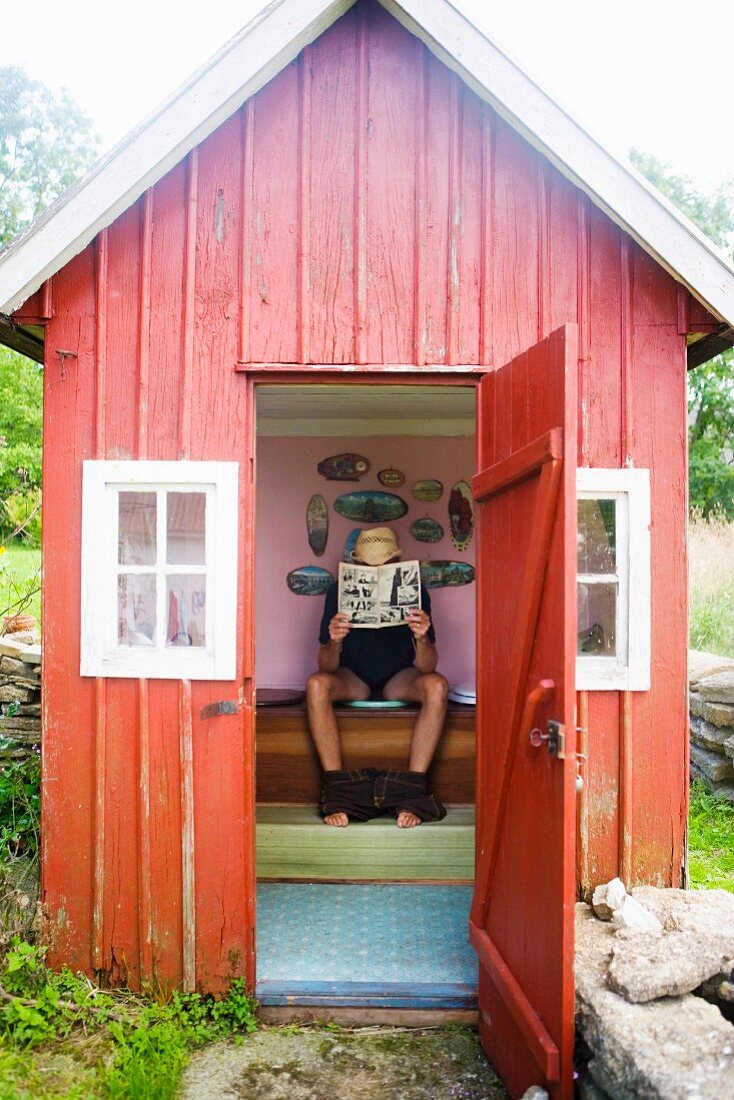 A man in an outhouse