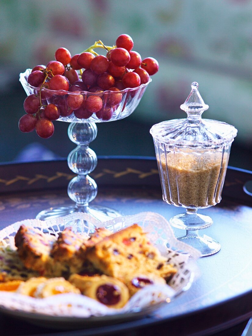 Grapes and sugar on a tray.