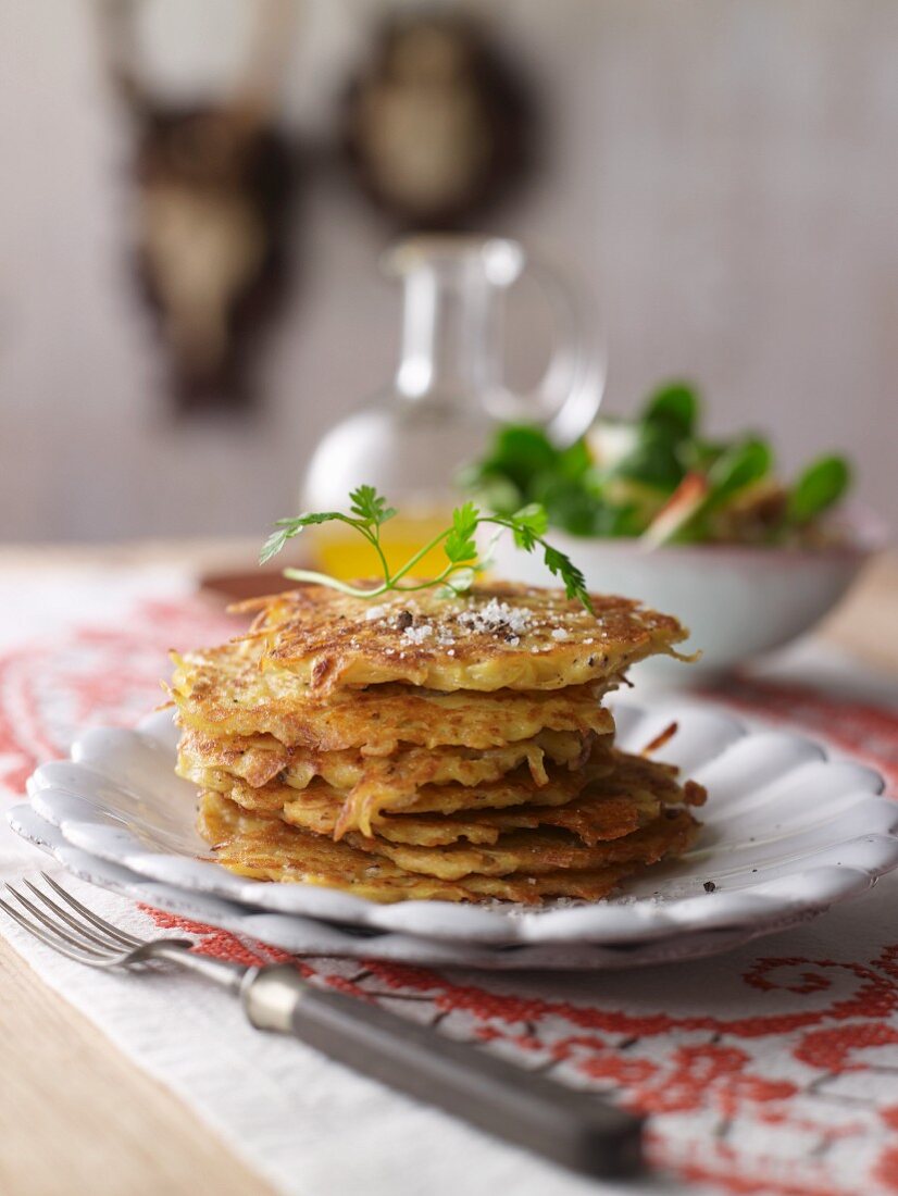 Cheese Rösti (fried Swiss potato cakes) with lamb's lettuce