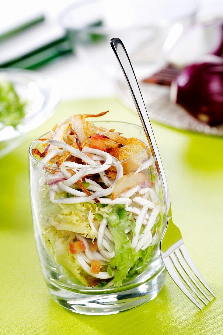 Seafood salad with croutons in a glass