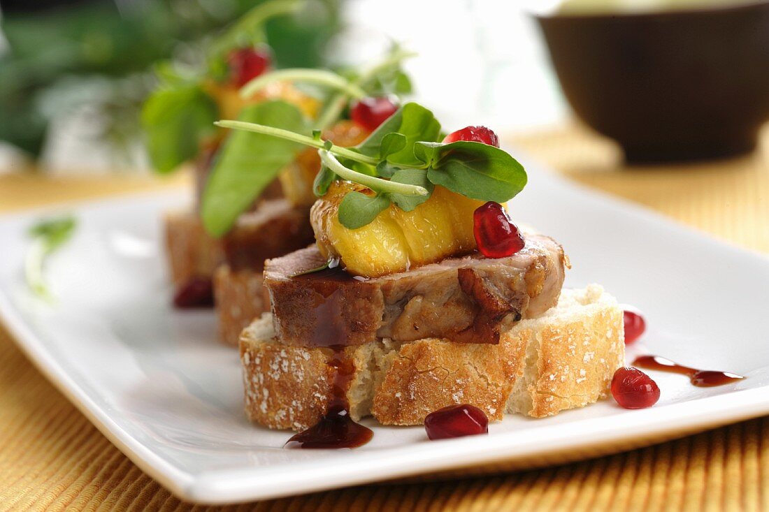 Pork canape with pineapple and raspberry vinegar
