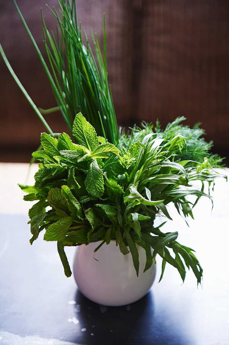 A bouquet of herbs including mint, tarragon, dill and chives