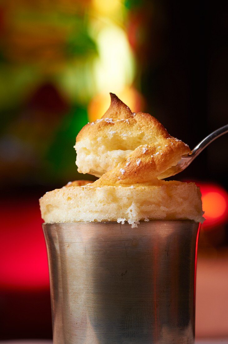 A soufflé in the mould, with a spoon