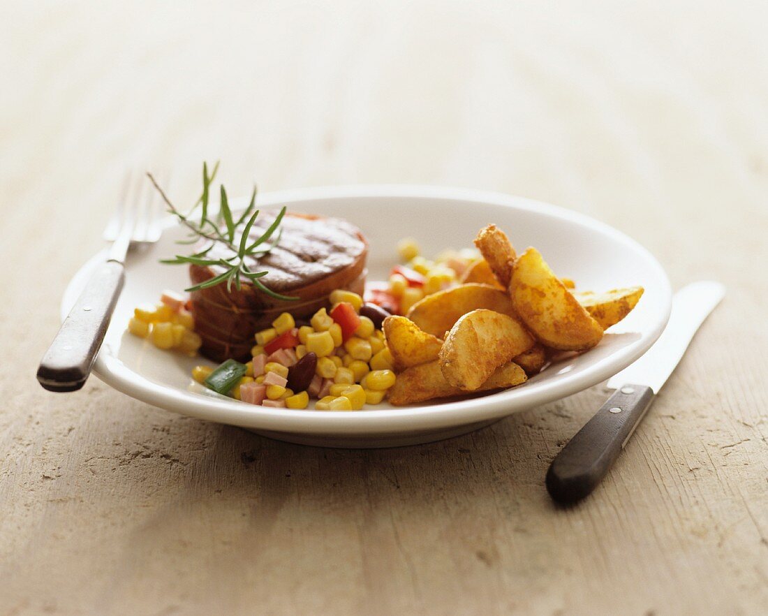 Beef medallion with sweetcorn salsa and potato wedges