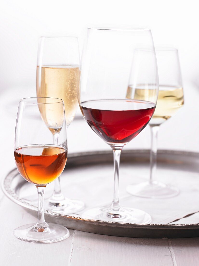 Various wines in glasses, one glass of sparkling wine
