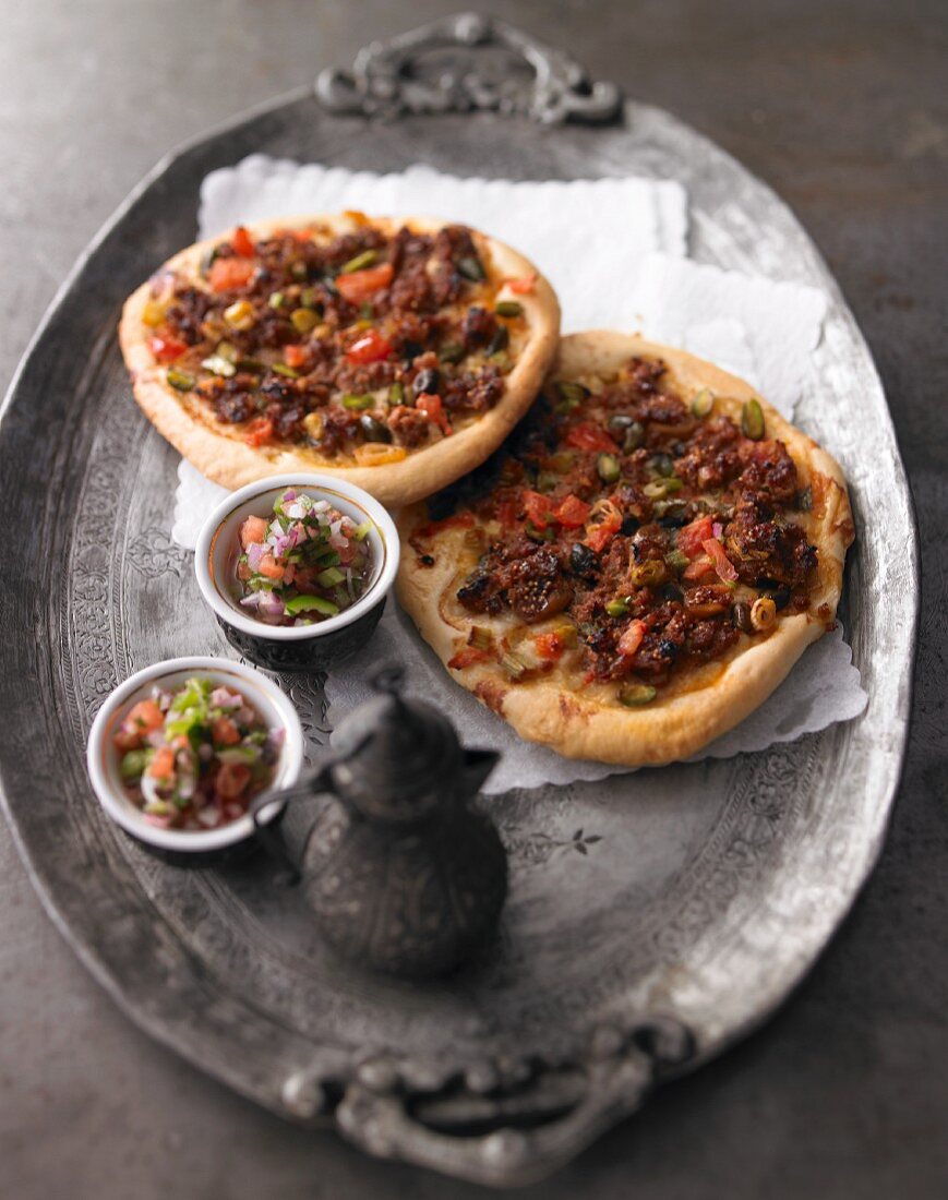 Turkish flatbread with minced meat, dates and pistachios