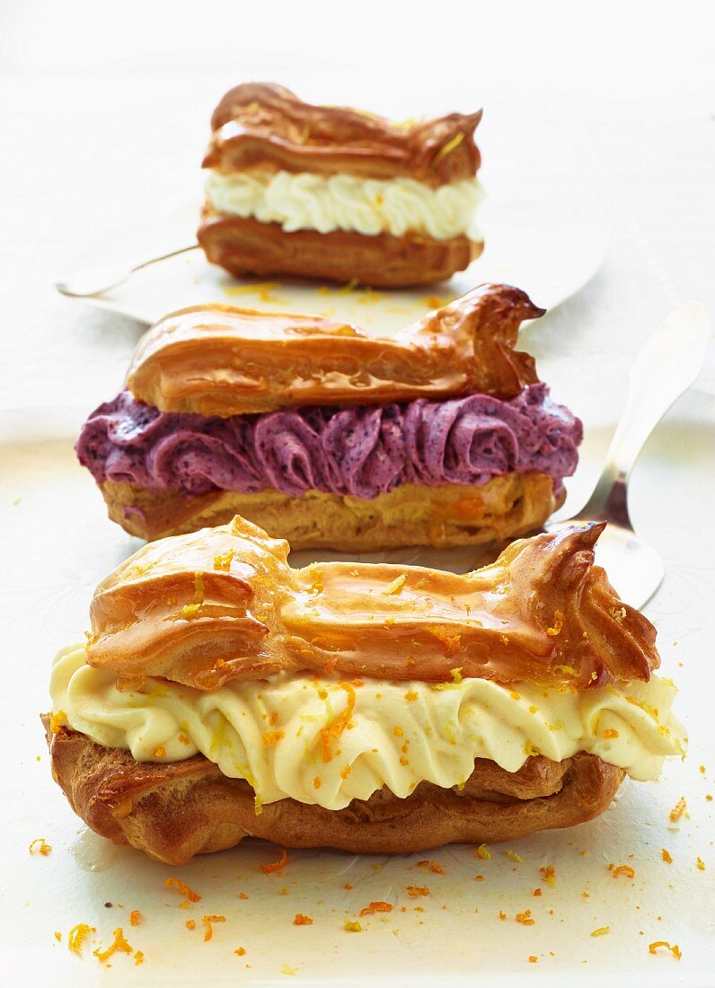 Eclairs Filled With Orange Crème … – License Image – 11221334 Image ...