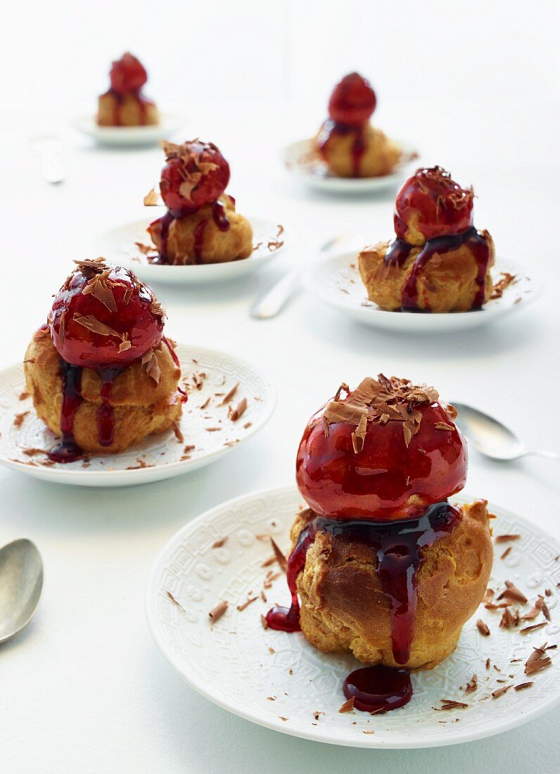 Choux pastry puffs with cherry mousse and grated chocolate