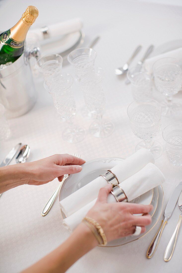 The laying of a table for a special occasion.