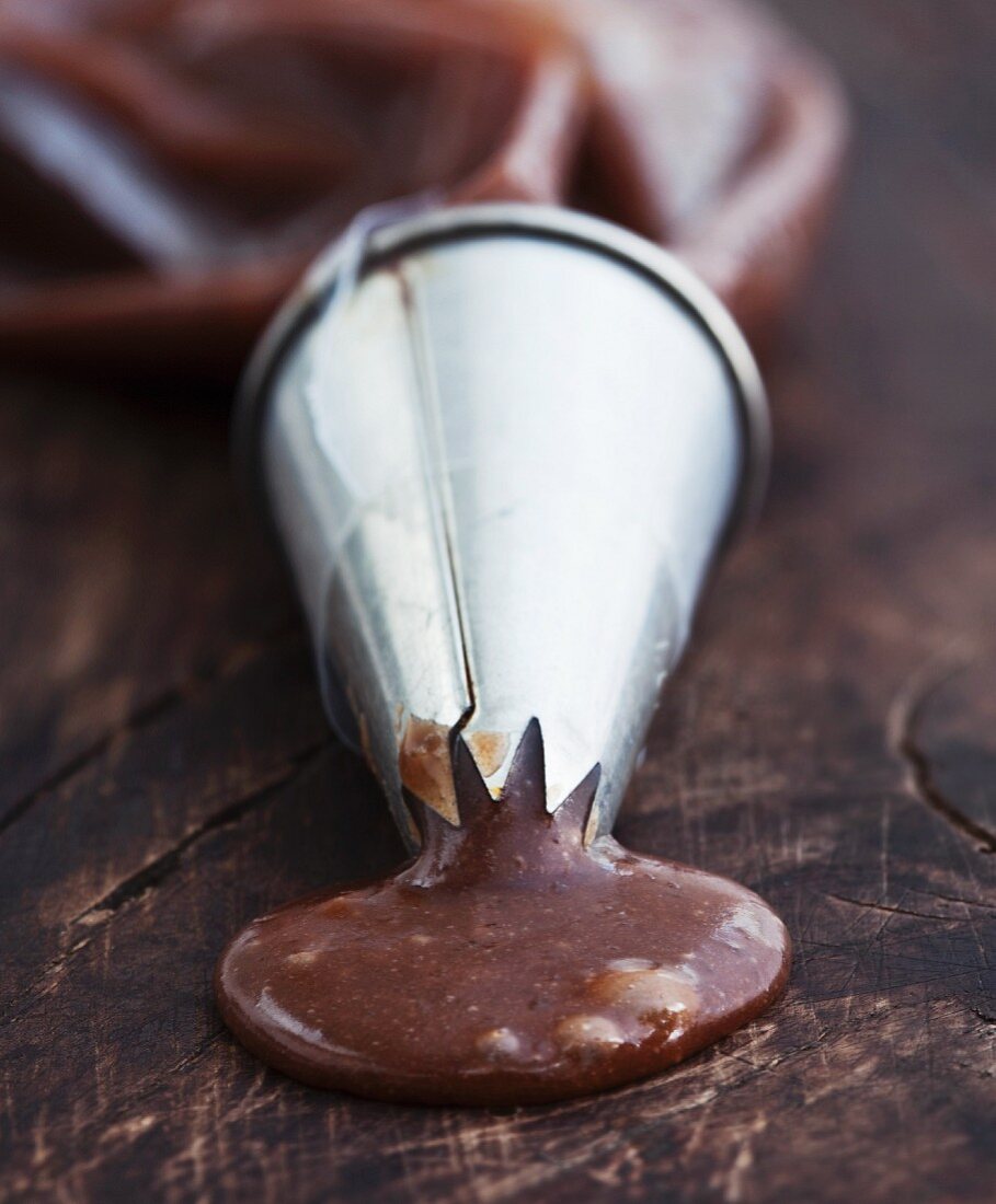 Liquidized chocolate coming out from cone