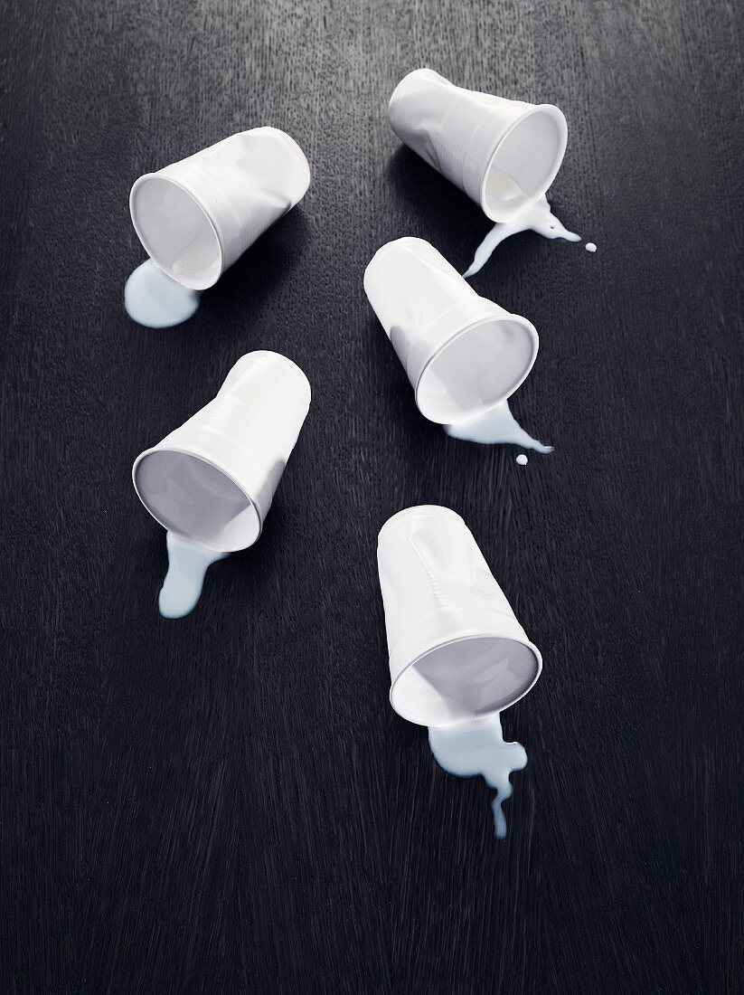 Cups with spilled milk