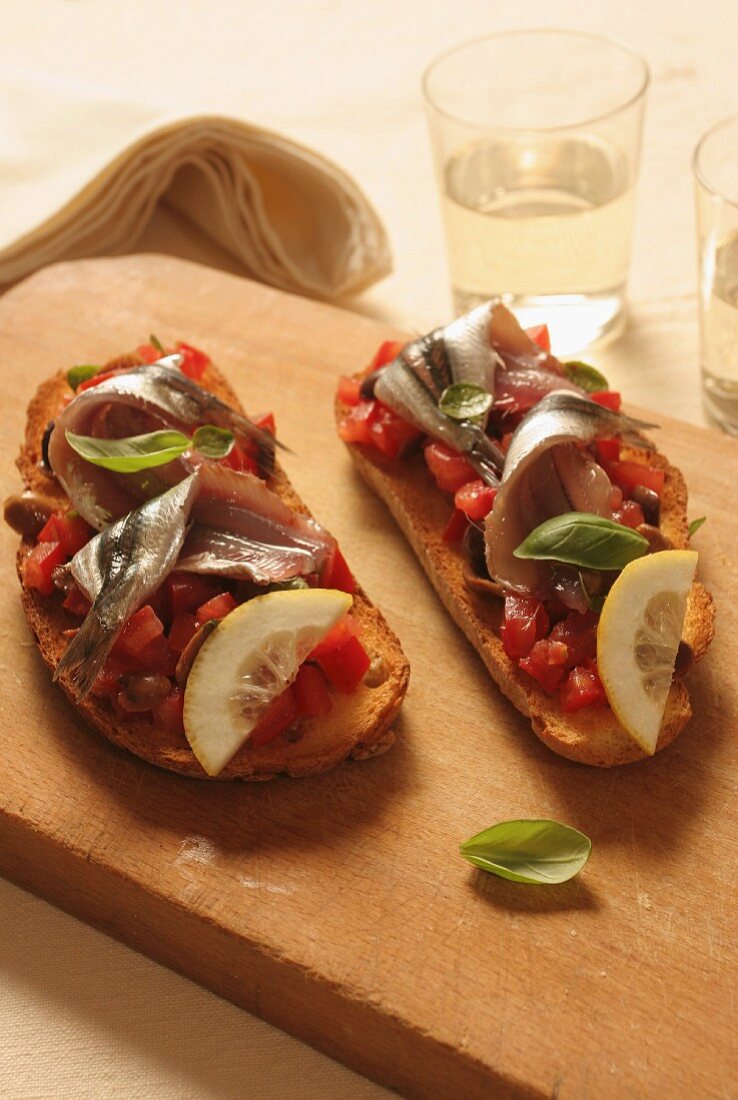 Toasted bread with tomatoes and pickled anchovies, Italy