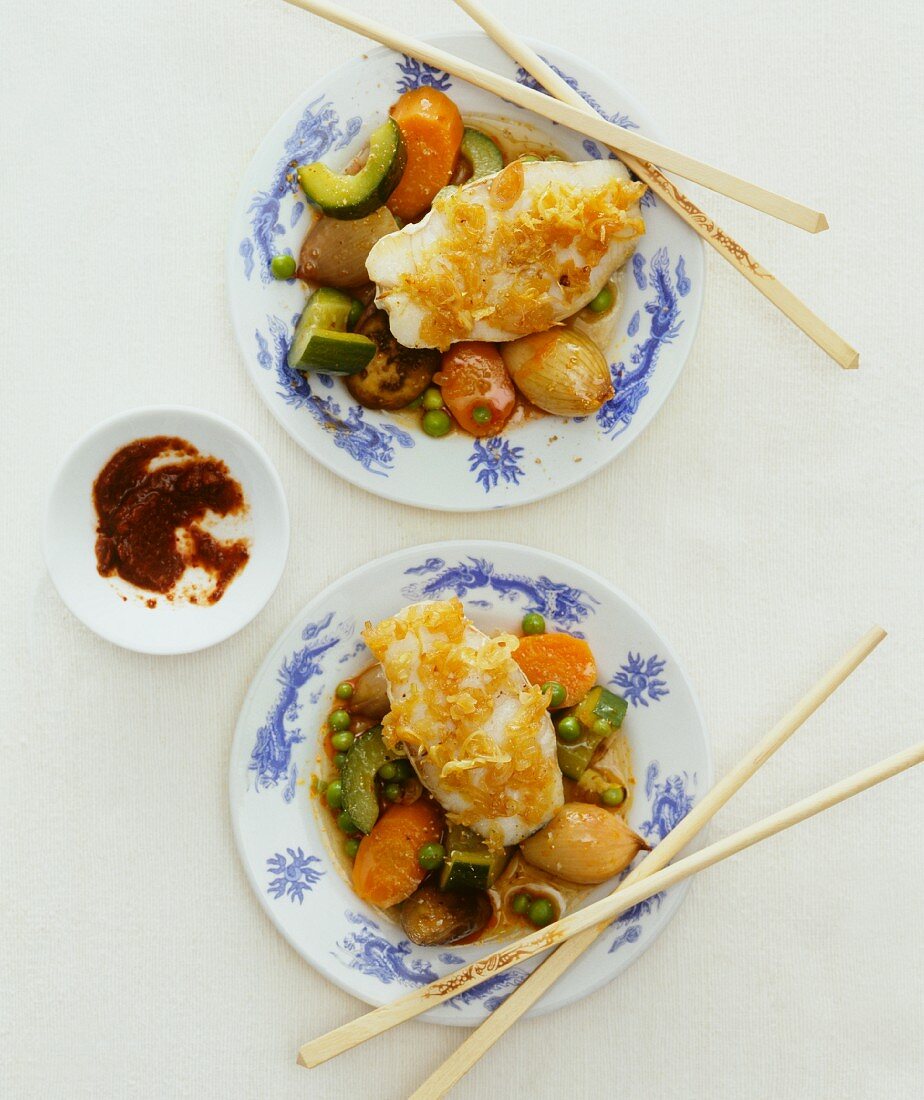 Fish fillet on a bed of vegetables (Asia)