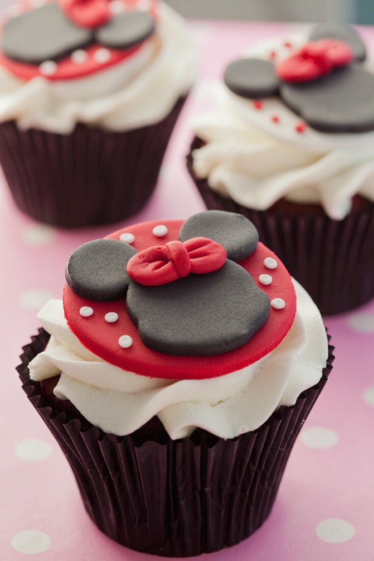 Chocolate cupcake decorated with Minnie Mouse and buttercream