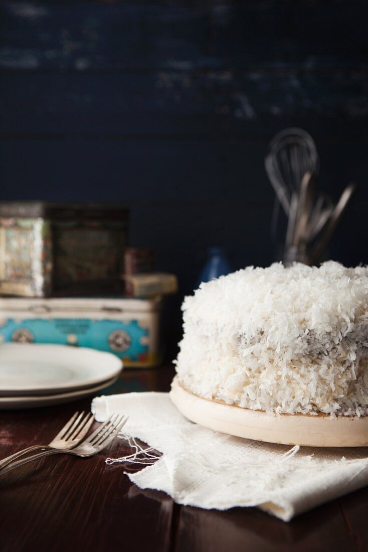 Carrot cake with cream cheese frosting and grated coconut