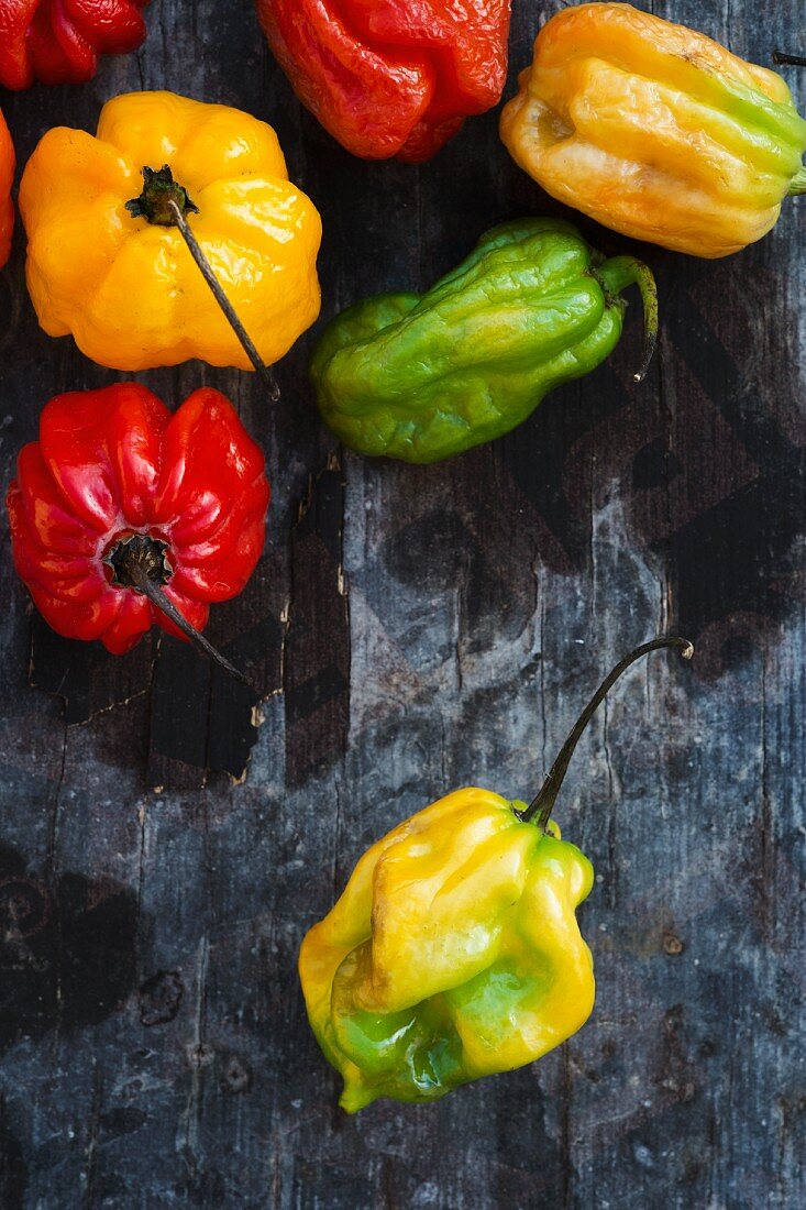 Assorted Habanero chillies on a wooden surface