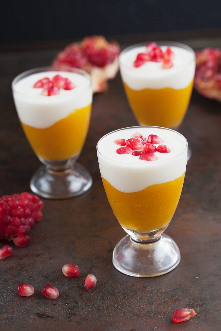 Mango purée with yoghurt and pomegranate seeds