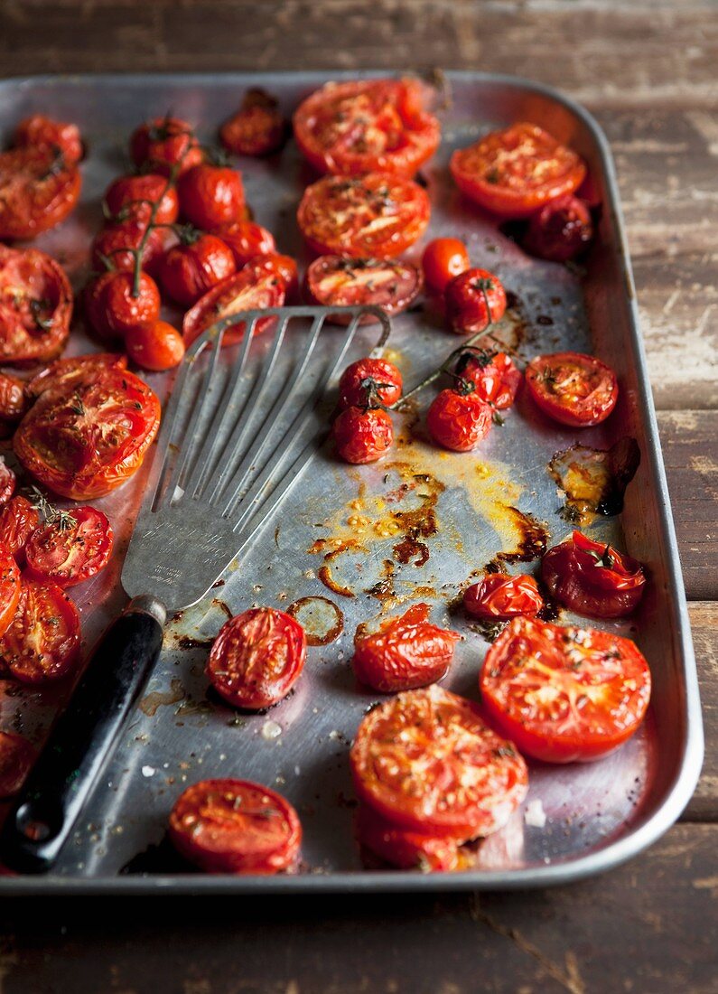 Oven-roasted tomatoes on a baking tray