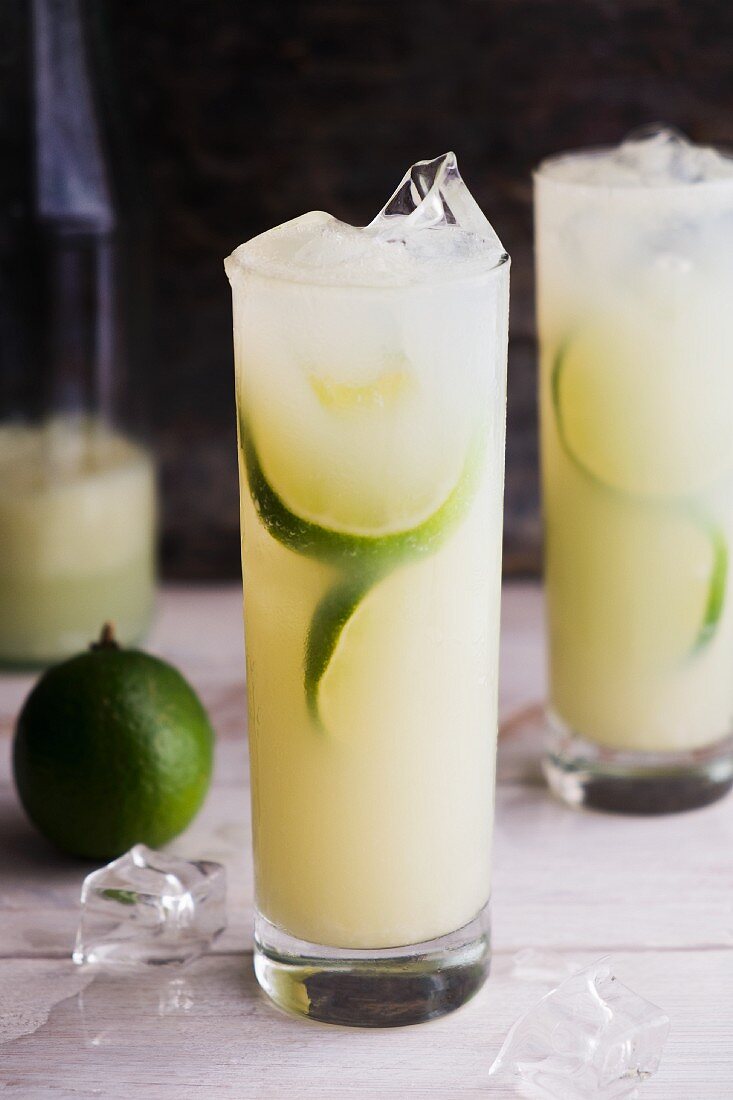 Vodka & lime cocktails with ice cubes