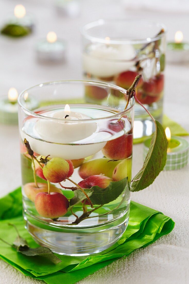 Candle lantern with floating candle and crab apples