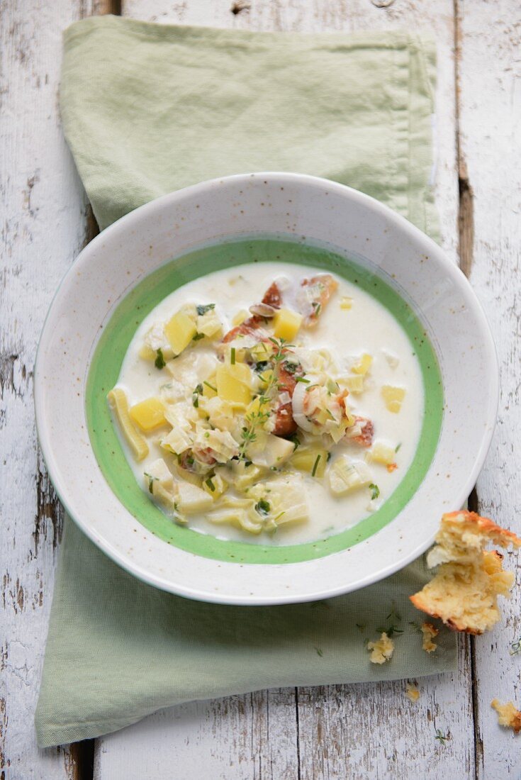 Leek and potato soup with celeriac and smoked fish