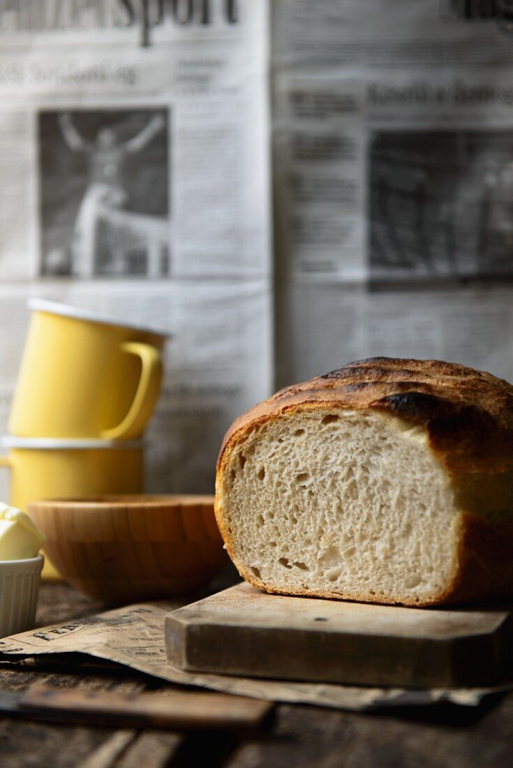 White bread, sliced to reveal the middle, on a chopping board