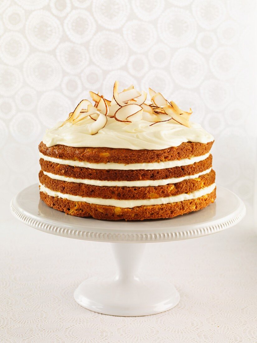 Carrot and coconut cake on a cake stand