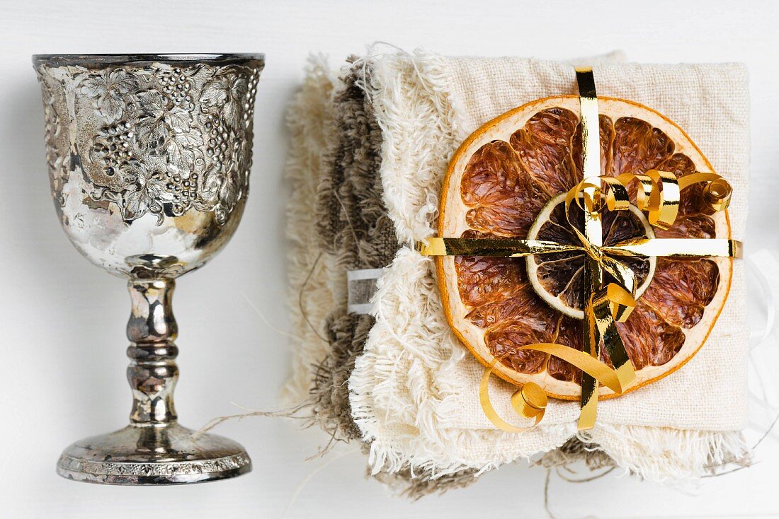 Dried fruits and a silver goblet as Christmas decorations