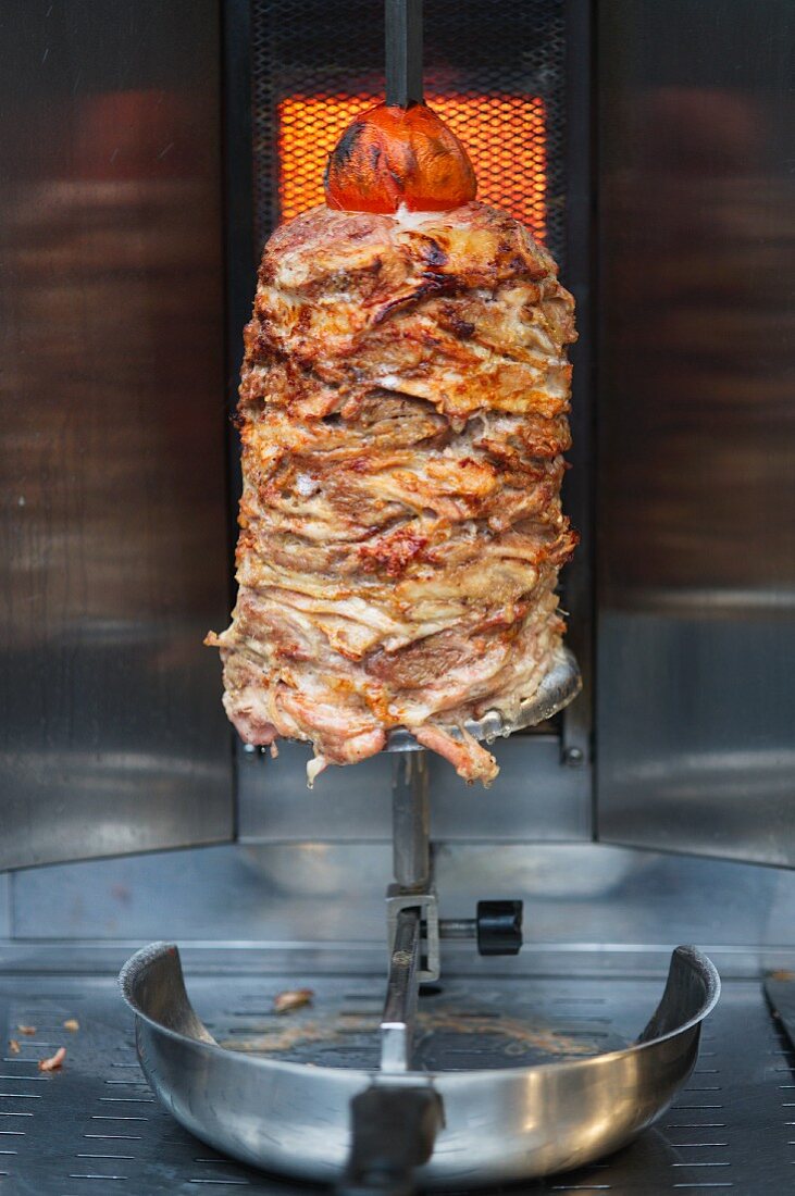 Doner kebab meat on a rotating skewer
