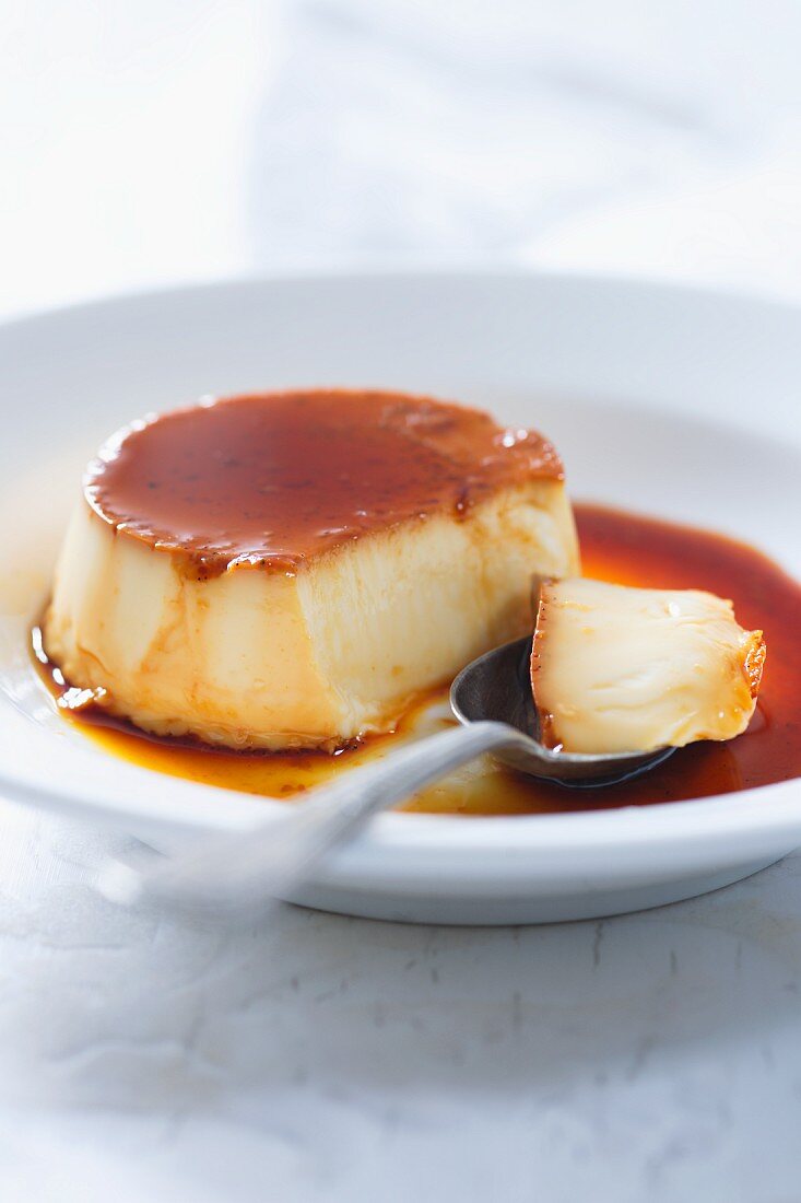 Crème caramel, partly eaten