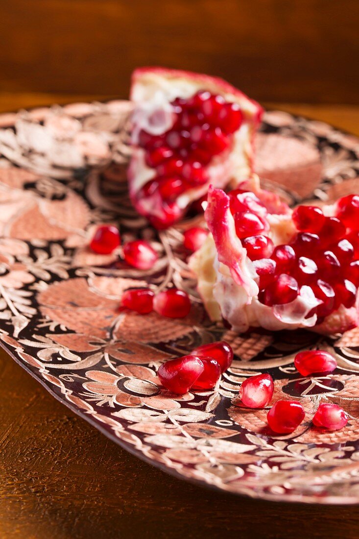 Pomegranate seeds and chunks of pomegranate in a dish